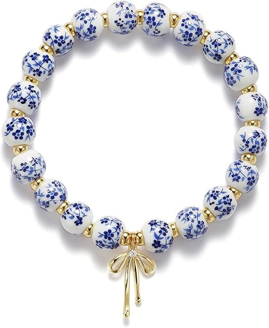 Blue & White Porcelain Beaded Bracelet with Gold Bow Charm – Elegant Stretch Bracelet for Women ✨
